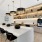 Clubhouse kitchen area with open shelving, large island and Bevi machine