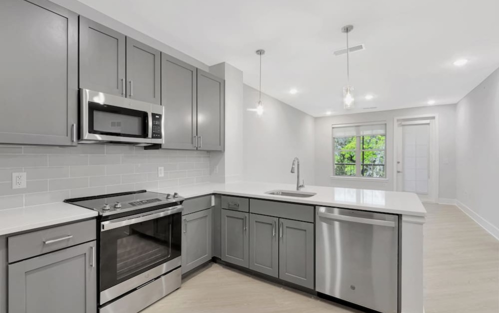 kitchen on wood-style flooring with modern appliances