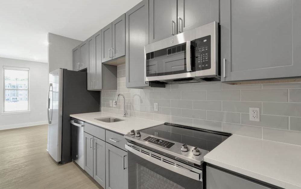 kitchen on wood-style flooring with modern appliances