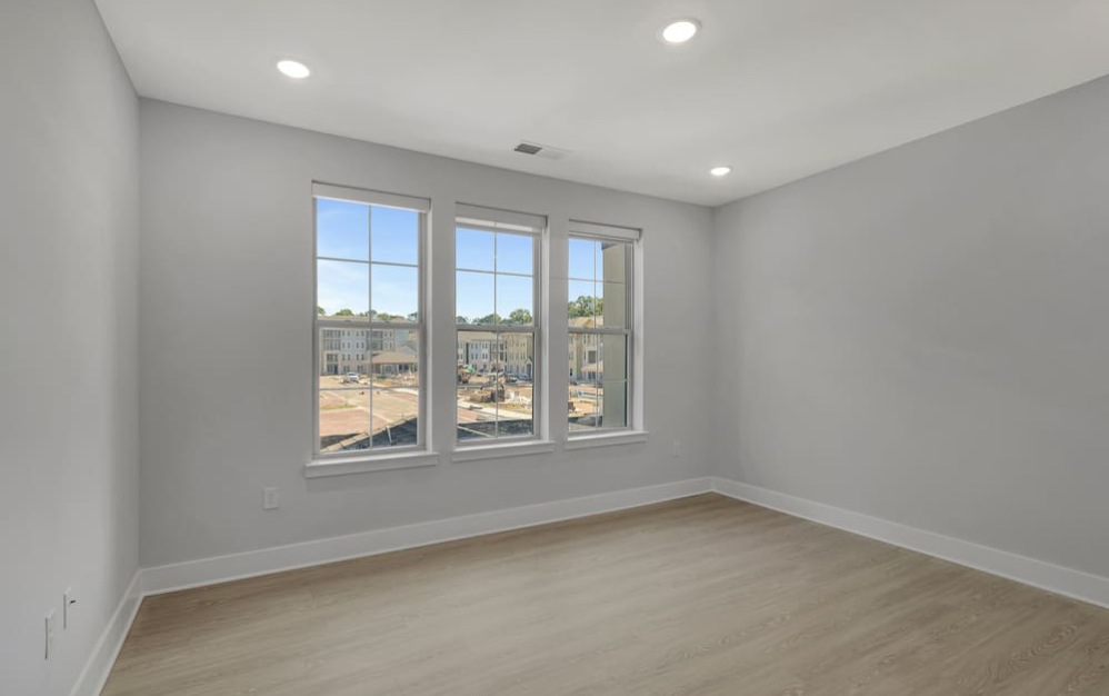 living room with wood-style flooring and bright spaces