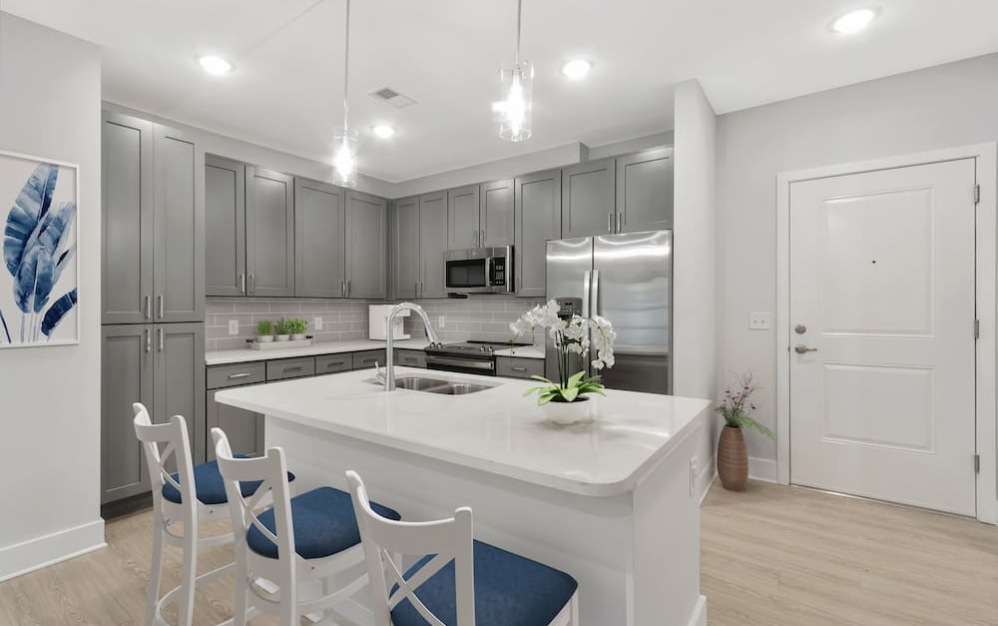 kitchen on wood-style flooring with modern appliances